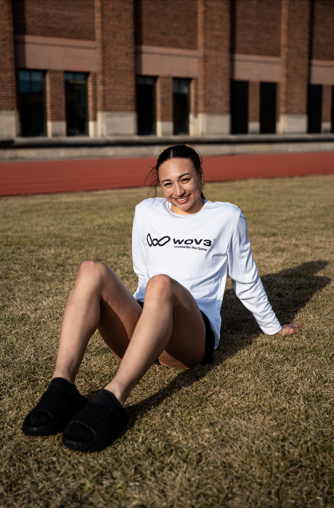 Wov3 athlete holding recovery footwear